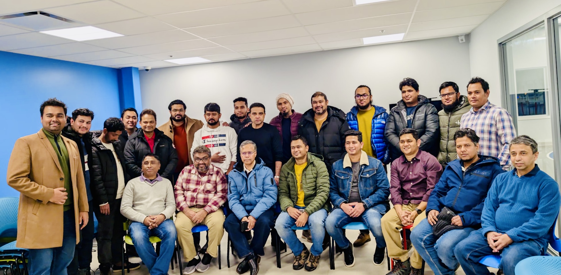 Orientation session with newcomers learning about community programs